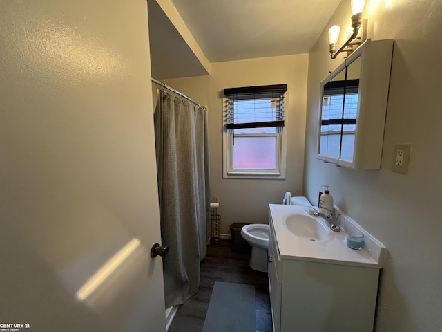 full bathroom with toilet, curtained shower, wood finished floors, and vanity