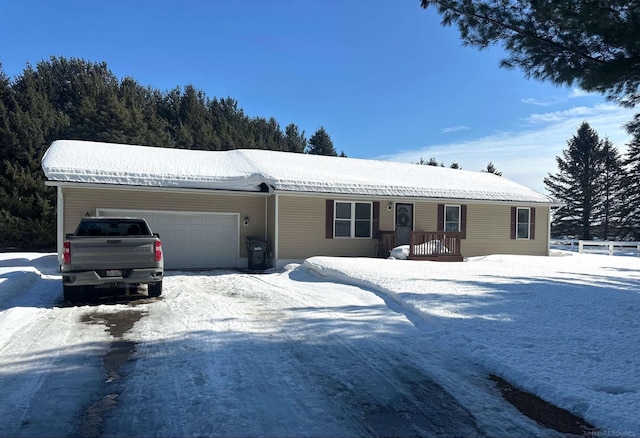 single story home with a garage and a porch