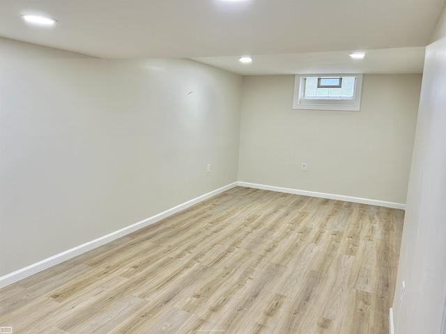 basement with light wood-style floors, recessed lighting, and baseboards