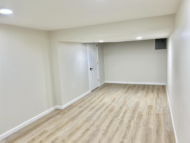 unfurnished room featuring light wood finished floors and baseboards