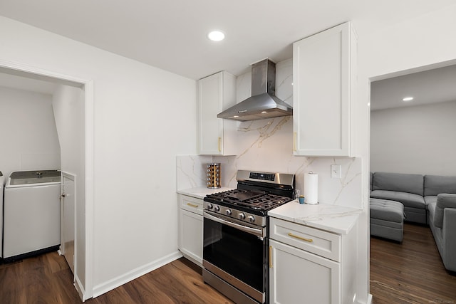 kitchen with dark wood-style floors, wall chimney exhaust hood, backsplash, and stainless steel range with gas stovetop