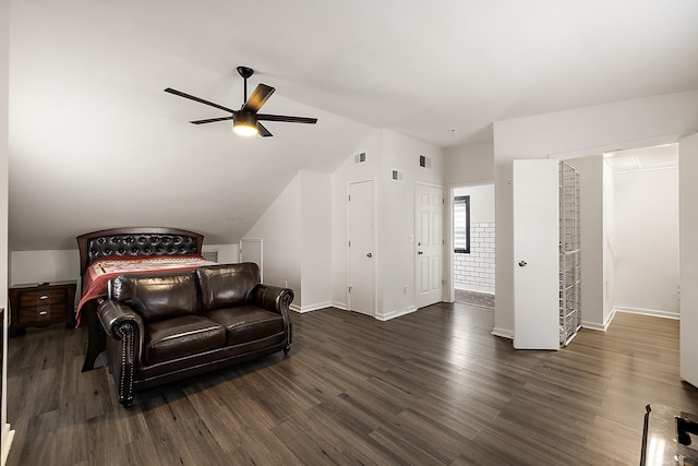 bedroom featuring a ceiling fan, baseboards, visible vents, and wood finished floors