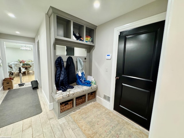 mudroom featuring baseboards, wood finished floors, and recessed lighting