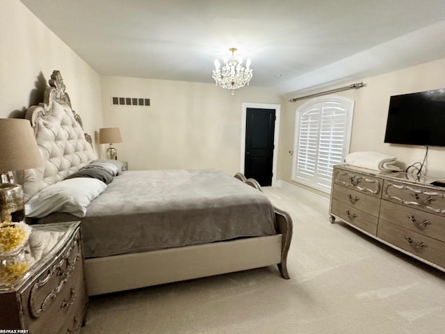 bedroom with light carpet, visible vents, and a chandelier