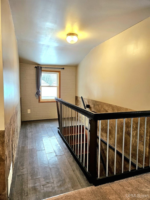 stairs with wood finished floors