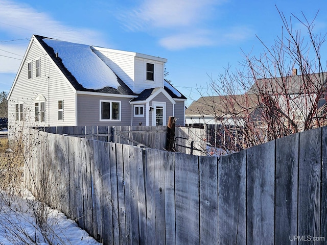 view of front of home with fence