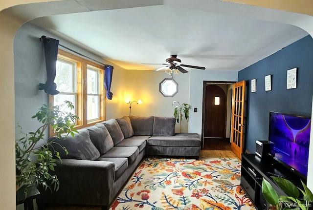 living room with ceiling fan and wood finished floors