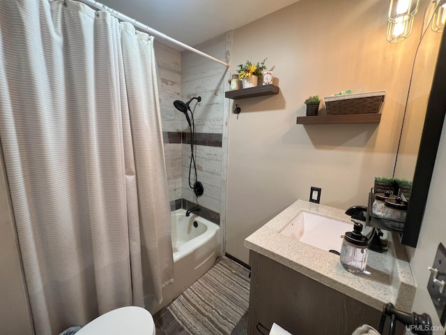 bathroom featuring toilet, shower / tub combo, and vanity