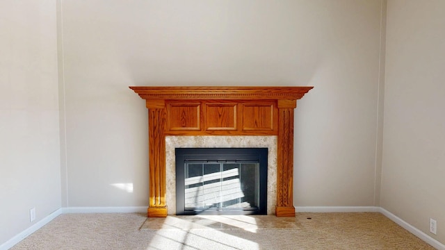 interior details with carpet floors, baseboards, and a high end fireplace