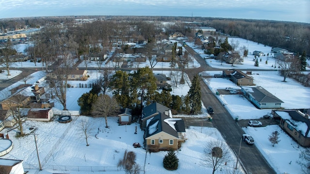 snowy aerial view featuring a residential view