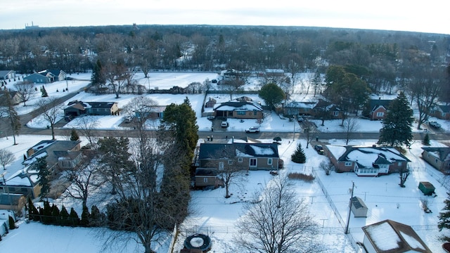 snowy aerial view featuring a residential view