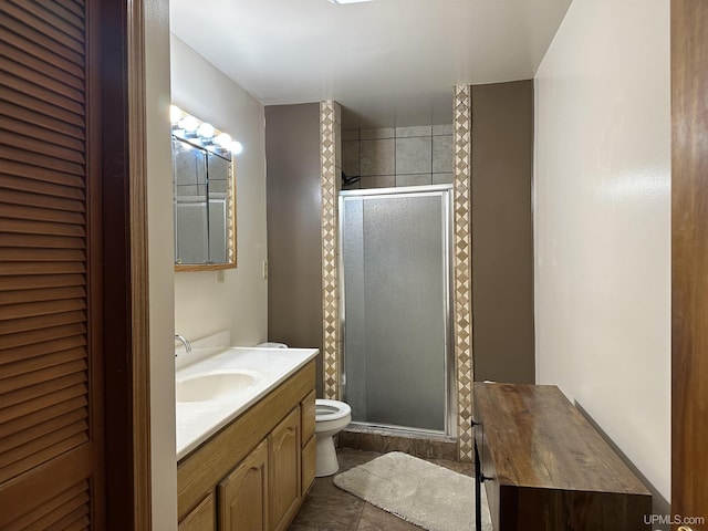 full bathroom with toilet, a shower stall, and vanity