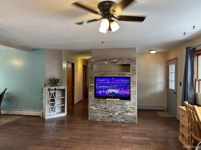 living area featuring a textured ceiling, a baseboard radiator, and wood finished floors