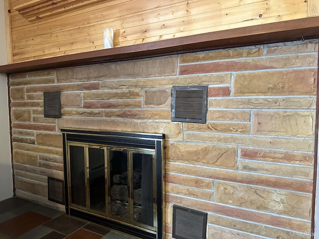 details with visible vents and a stone fireplace