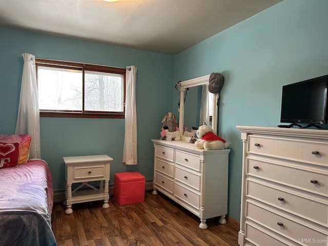 bedroom with dark wood-style floors