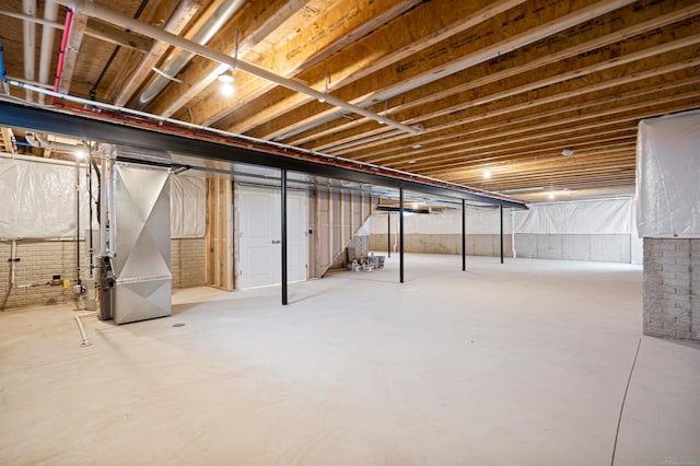 unfinished basement with heating unit