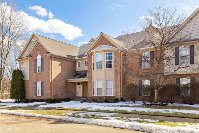 view of front of property featuring brick siding