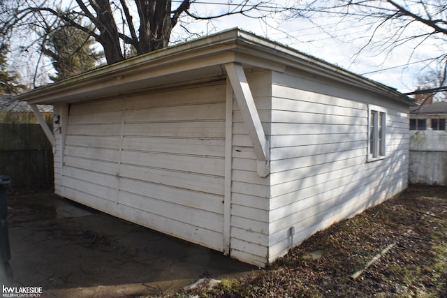 garage with fence