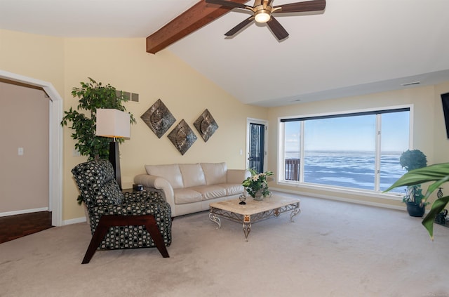 living room with visible vents, baseboards, lofted ceiling with beams, ceiling fan, and carpet