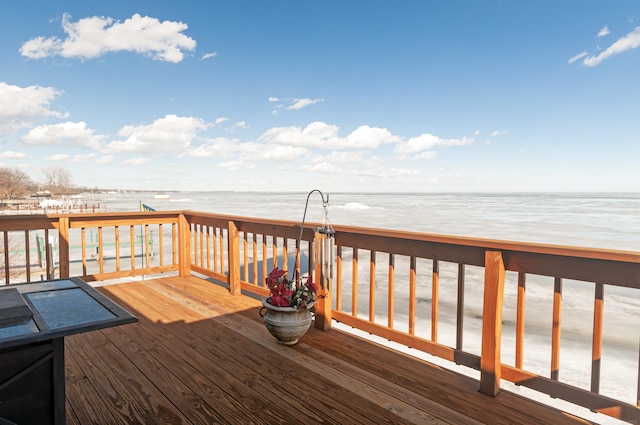 wooden terrace with a water view