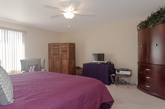 bedroom featuring light carpet and ceiling fan