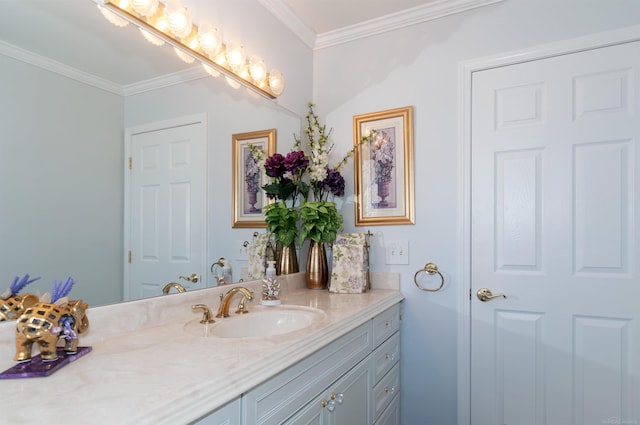 bathroom with crown molding and vanity