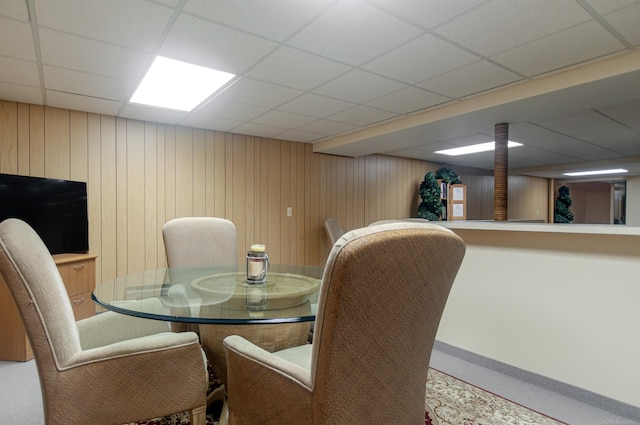 dining area with a drop ceiling