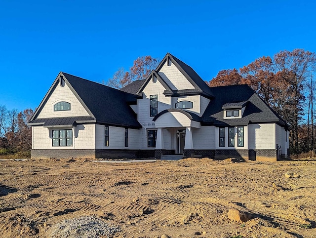 view of front facade featuring a standing seam roof and metal roof