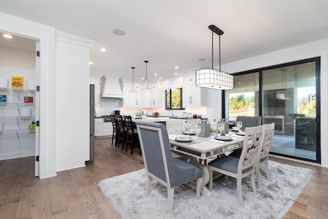 dining area featuring recessed lighting and wood finished floors