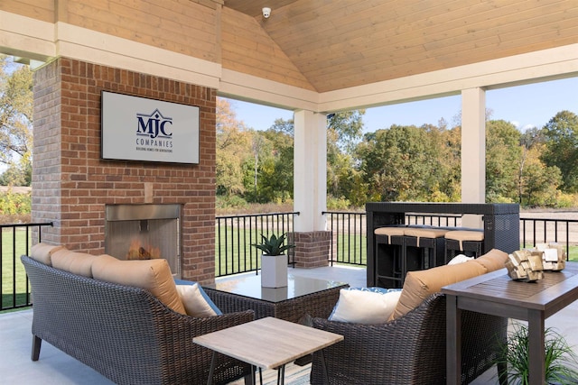 deck featuring an outdoor living space with a fireplace