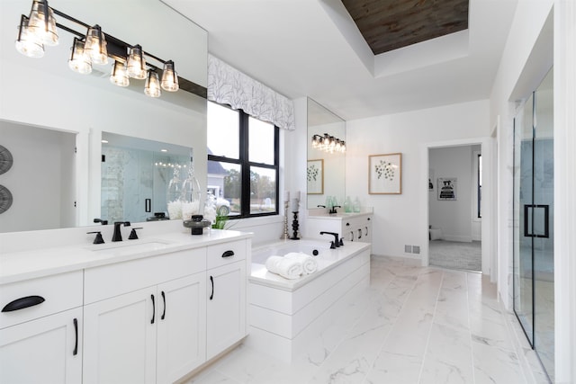 full bathroom featuring marble finish floor, a stall shower, a sink, and visible vents