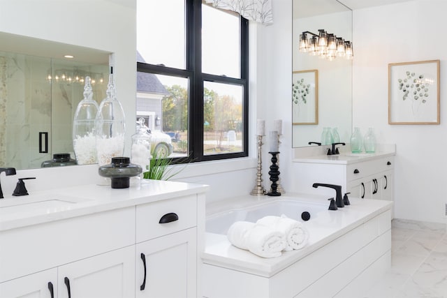 full bath with marble finish floor, a stall shower, a garden tub, and vanity