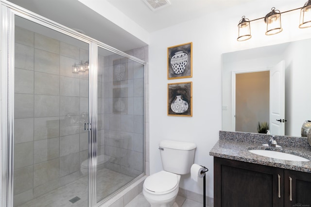 full bathroom featuring toilet, a stall shower, visible vents, and vanity