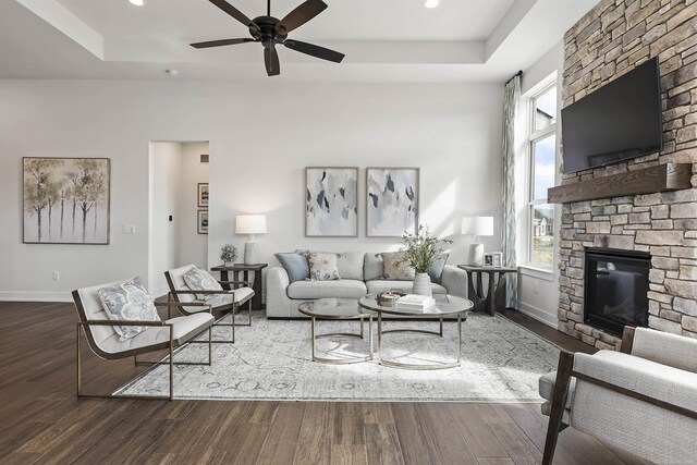 3888 Chatham Pl Unit 99, Brighton, MI 48114 - living area featuring a raised ceiling and wood finished floors