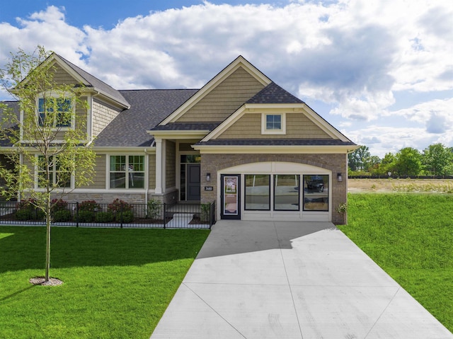 3888 Chatham Pl Unit 99, Brighton, MI 48114 - craftsman house with driveway, a front lawn, a shingled roof, and fence
