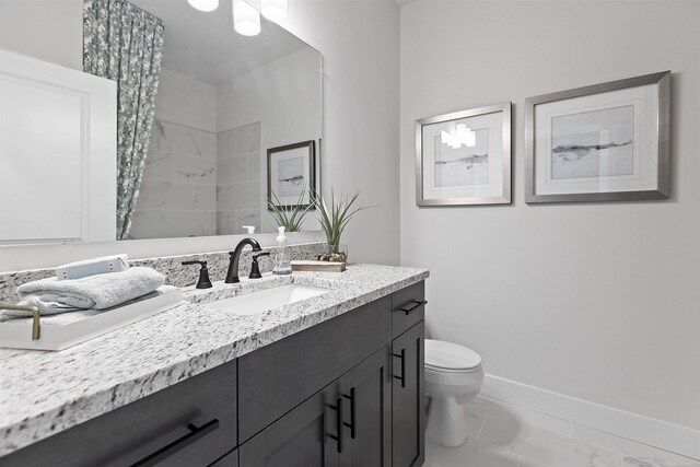 3888 Chatham Pl Unit 99, Brighton, MI 48114 - bathroom featuring toilet, baseboards, and vanity