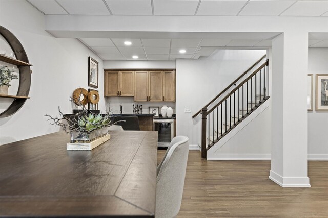 3888 Chatham Pl Unit 99, Brighton, MI 48114 - dining area with recessed lighting, beverage cooler, wood finished floors, baseboards, and stairway