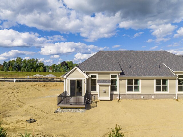 3888 Chatham Pl Unit 99, Brighton, MI 48114 - rear view of house with a shingled roof