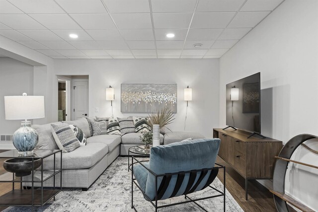 3888 Chatham Pl Unit 99, Brighton, MI 48114 - living area with recessed lighting, a drop ceiling, and wood finished floors