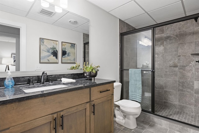 3888 Chatham Pl Unit 99, Brighton, MI 48114 - bathroom featuring toilet, a stall shower, vanity, and visible vents