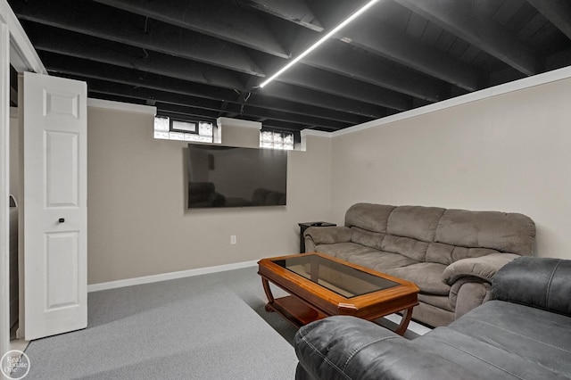 living area with baseboards and carpet flooring