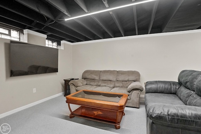 carpeted living area with baseboards