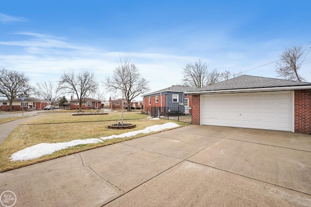 exterior space featuring a garage, a residential view, and fence