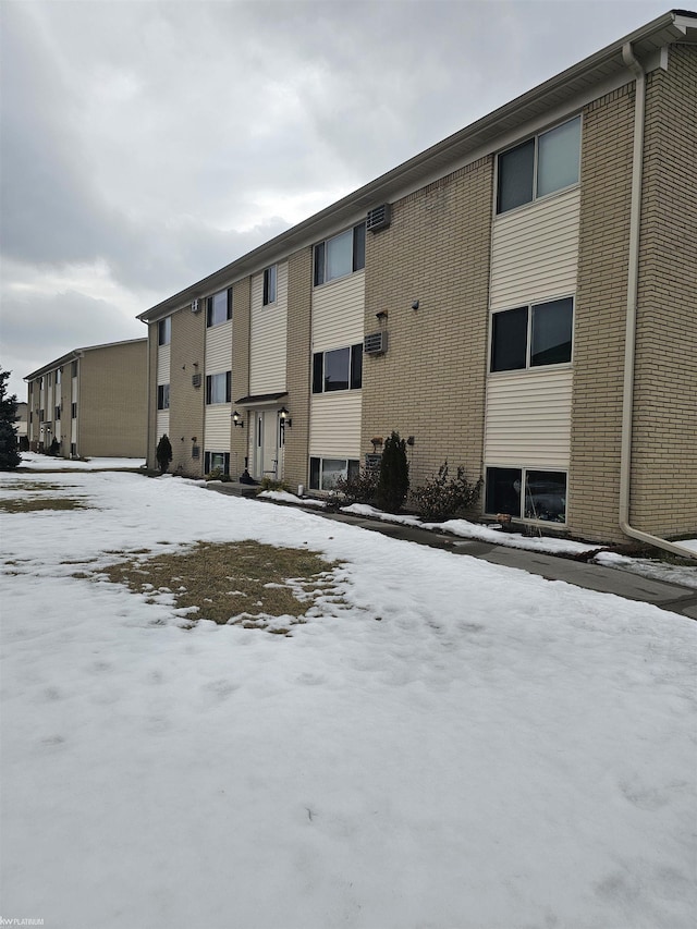 view of snow covered property