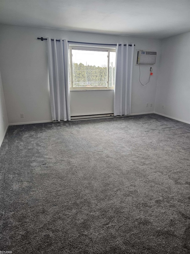 empty room with carpet, baseboards, and an AC wall unit