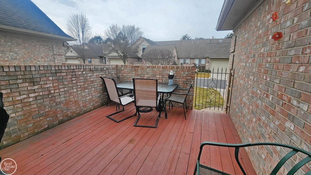 wooden terrace with outdoor dining area