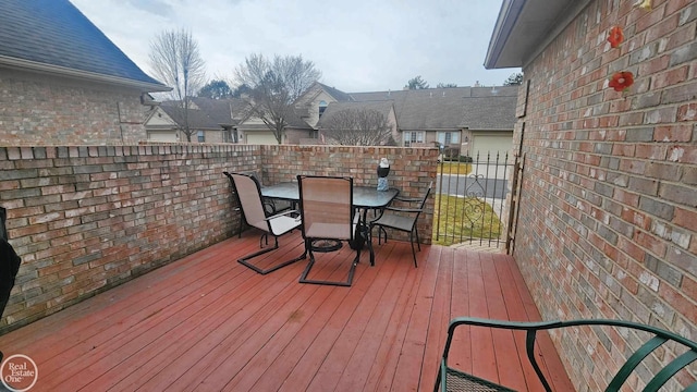 wooden terrace with outdoor dining area