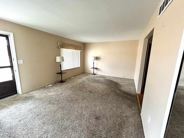 interior space featuring carpet and visible vents