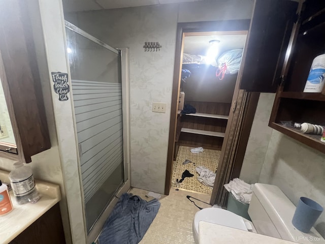 full bathroom with a shower stall and toilet