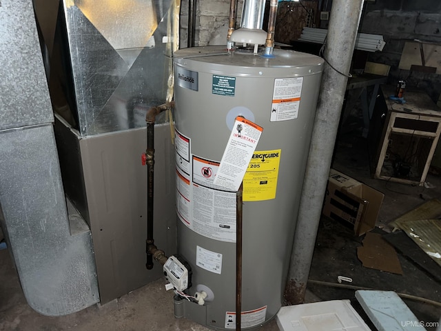 utility room featuring gas water heater and heating unit